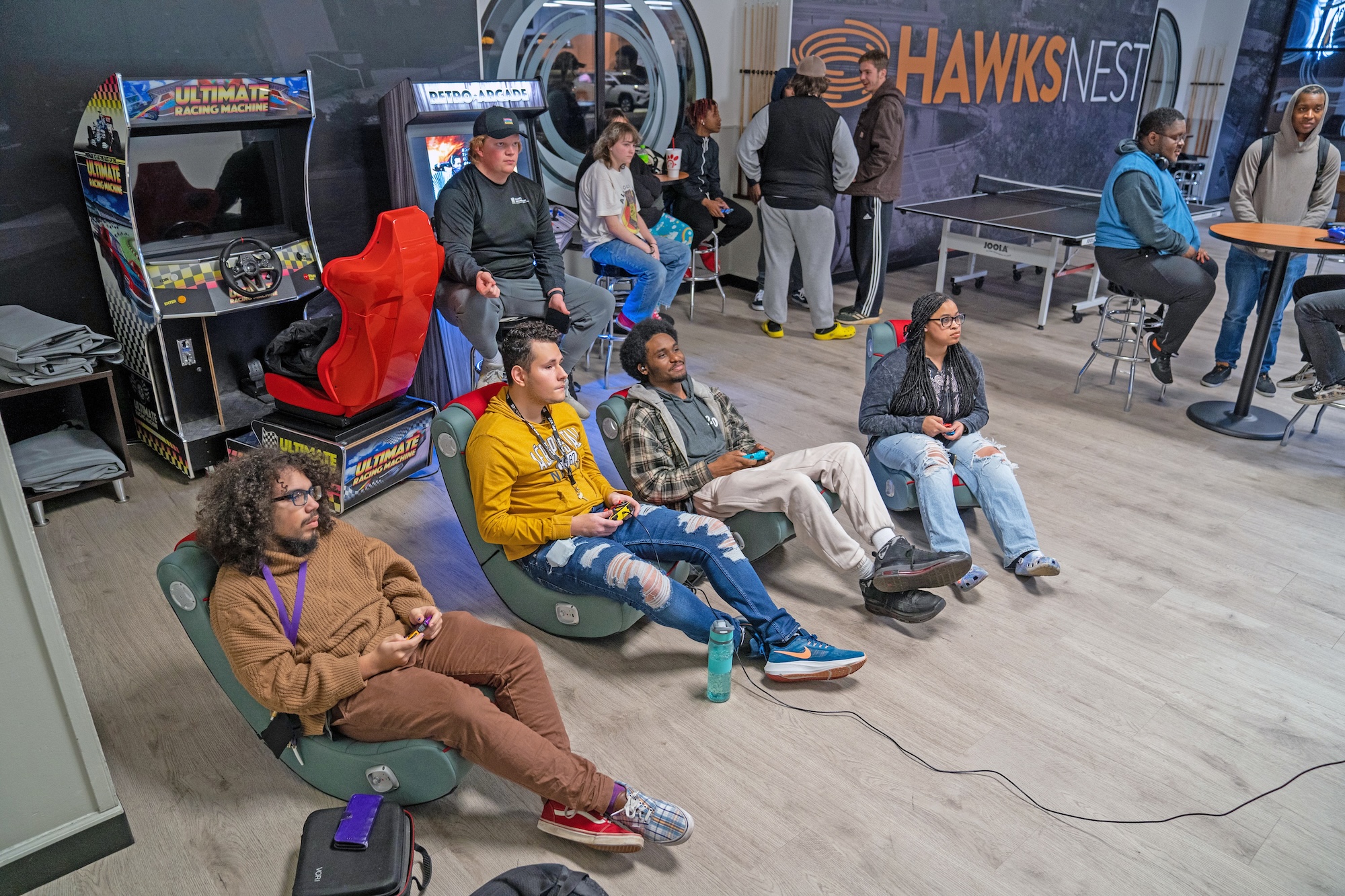 Students play Mario Kart at the Hawks Nest