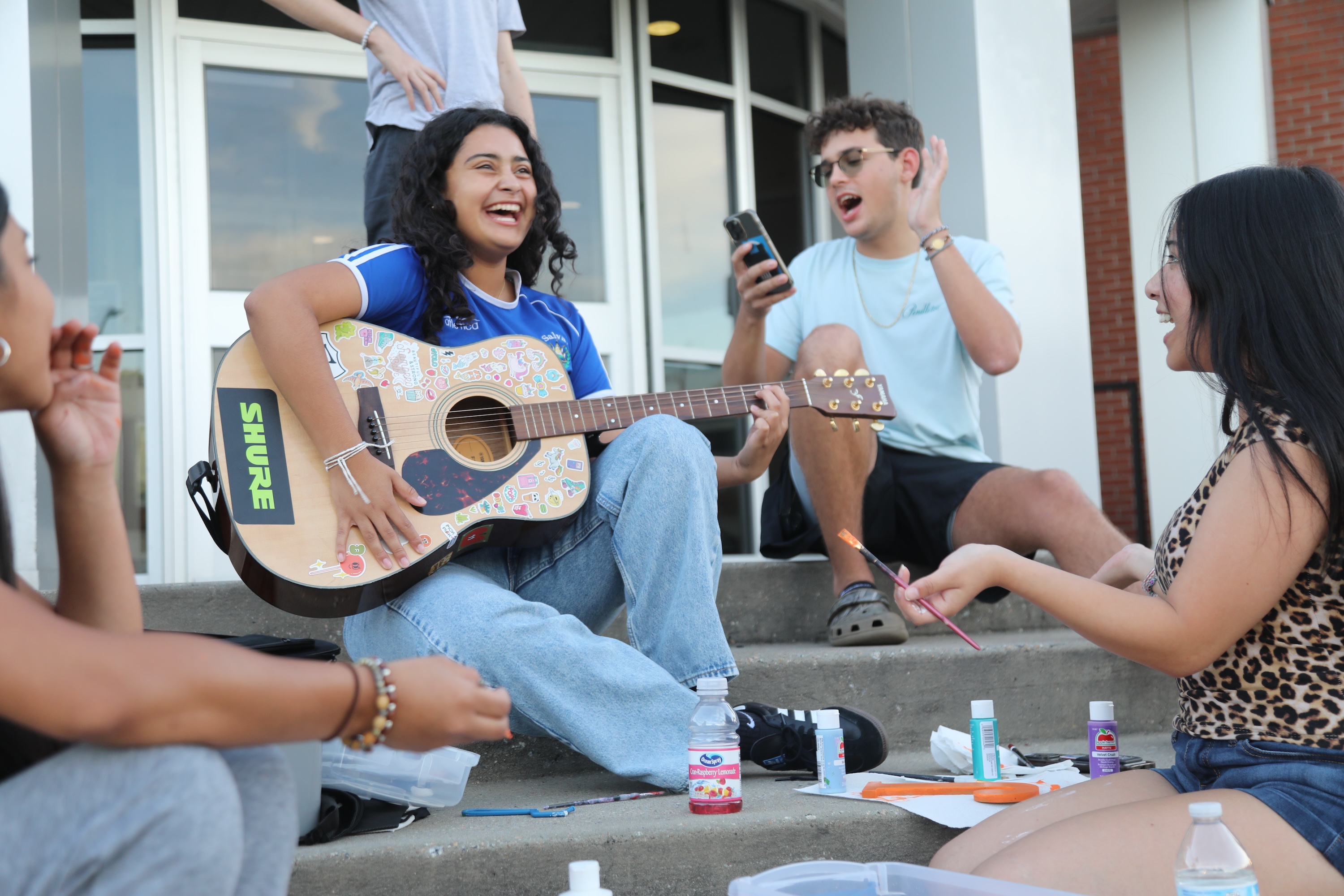 Students on guitar and singing on UNCP campus