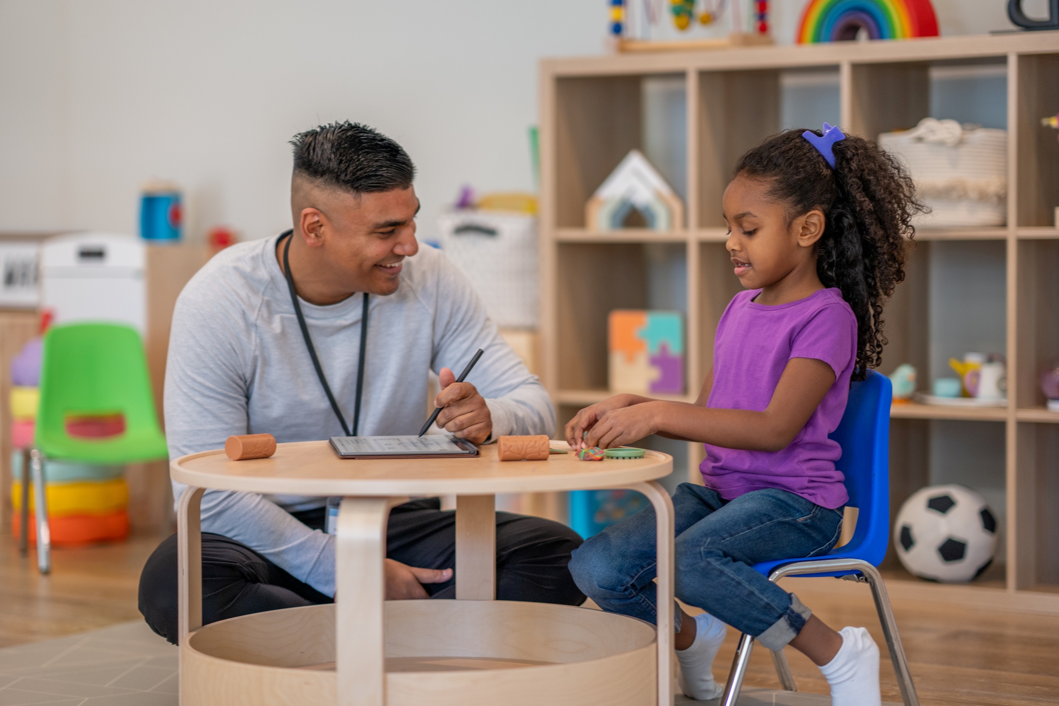 Social worker with student in classroom
