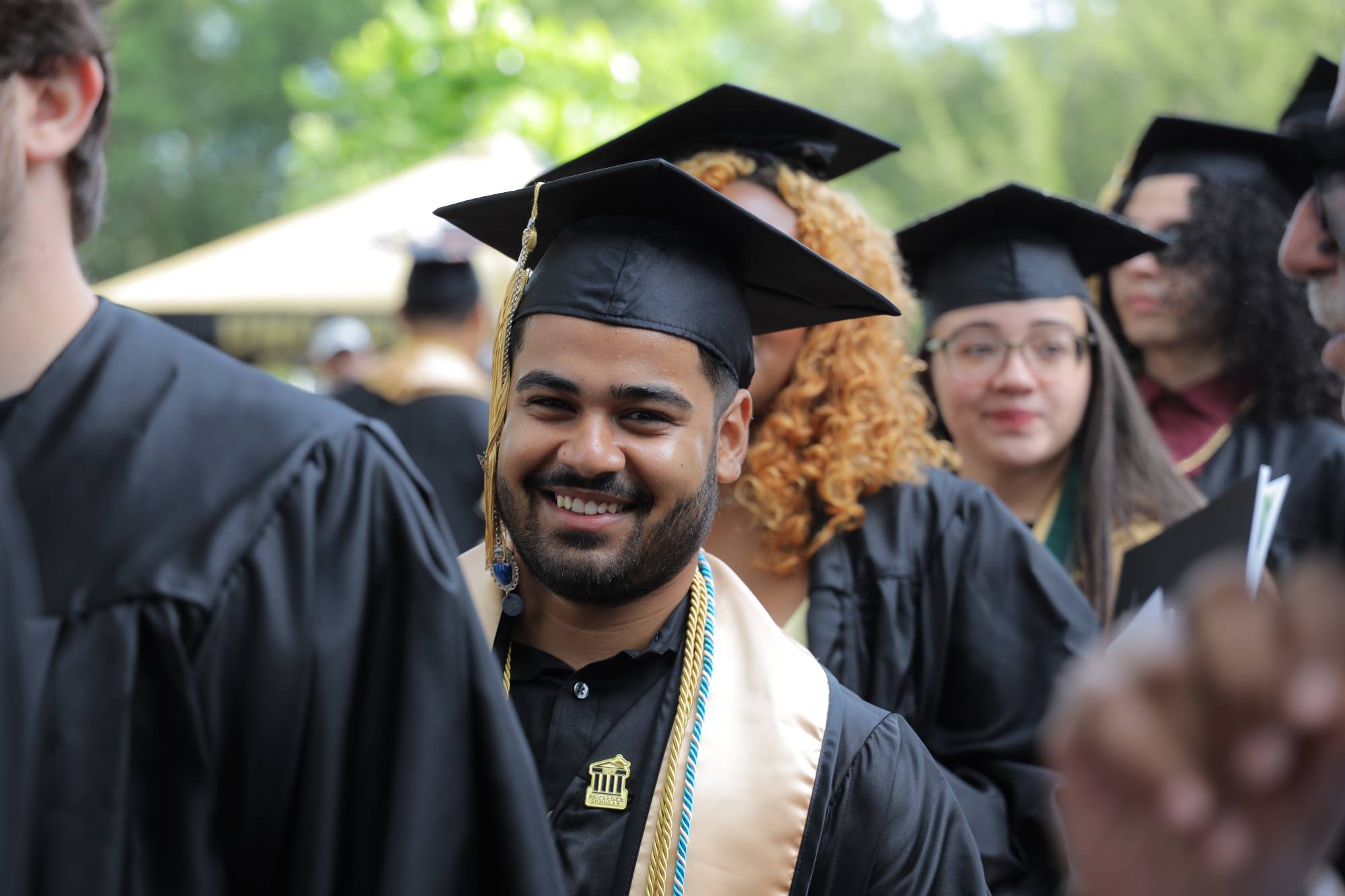 UNC Pembroke male graduate smiling
