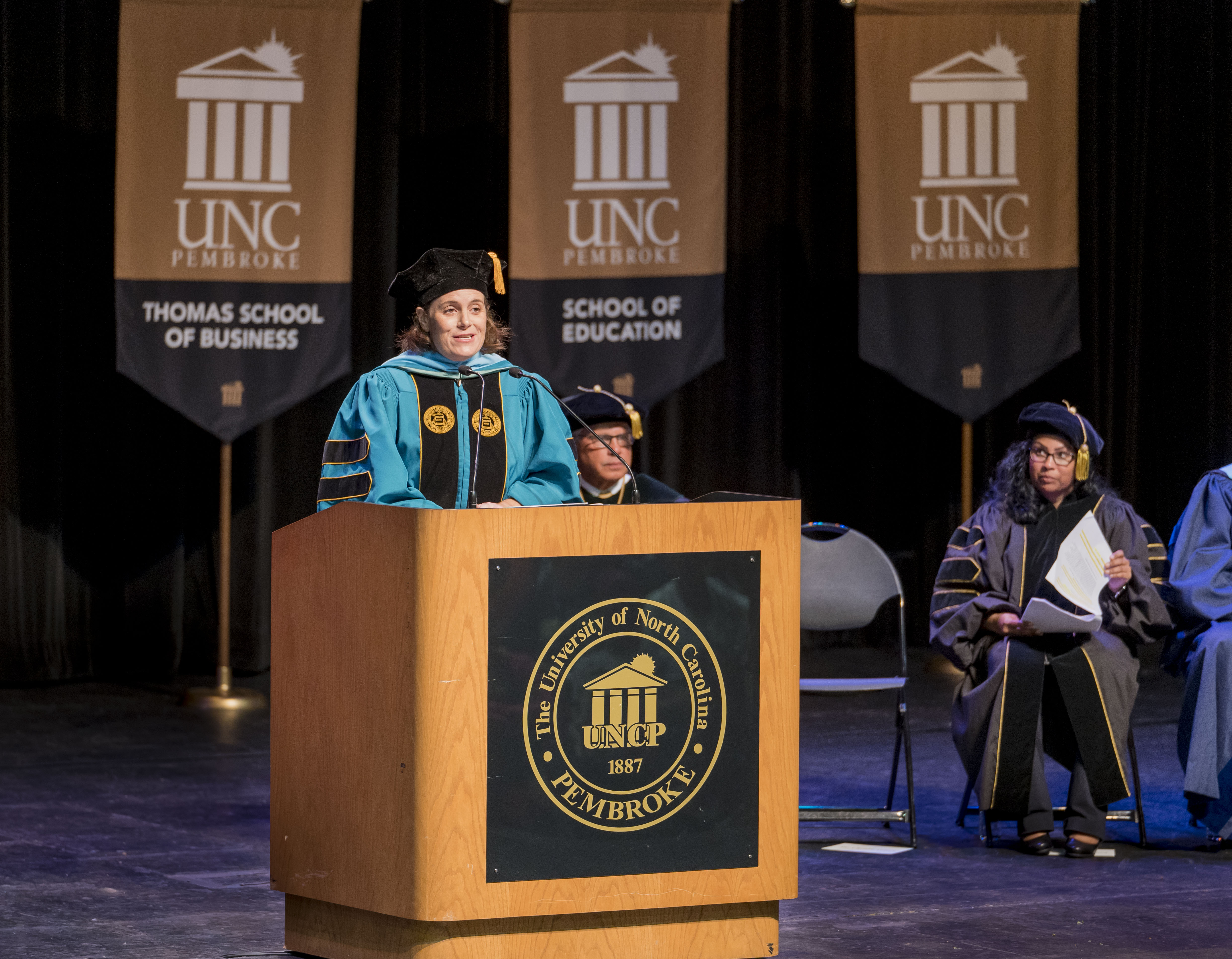Dr. Chrisite Poteet on stage delivering the keynote speech