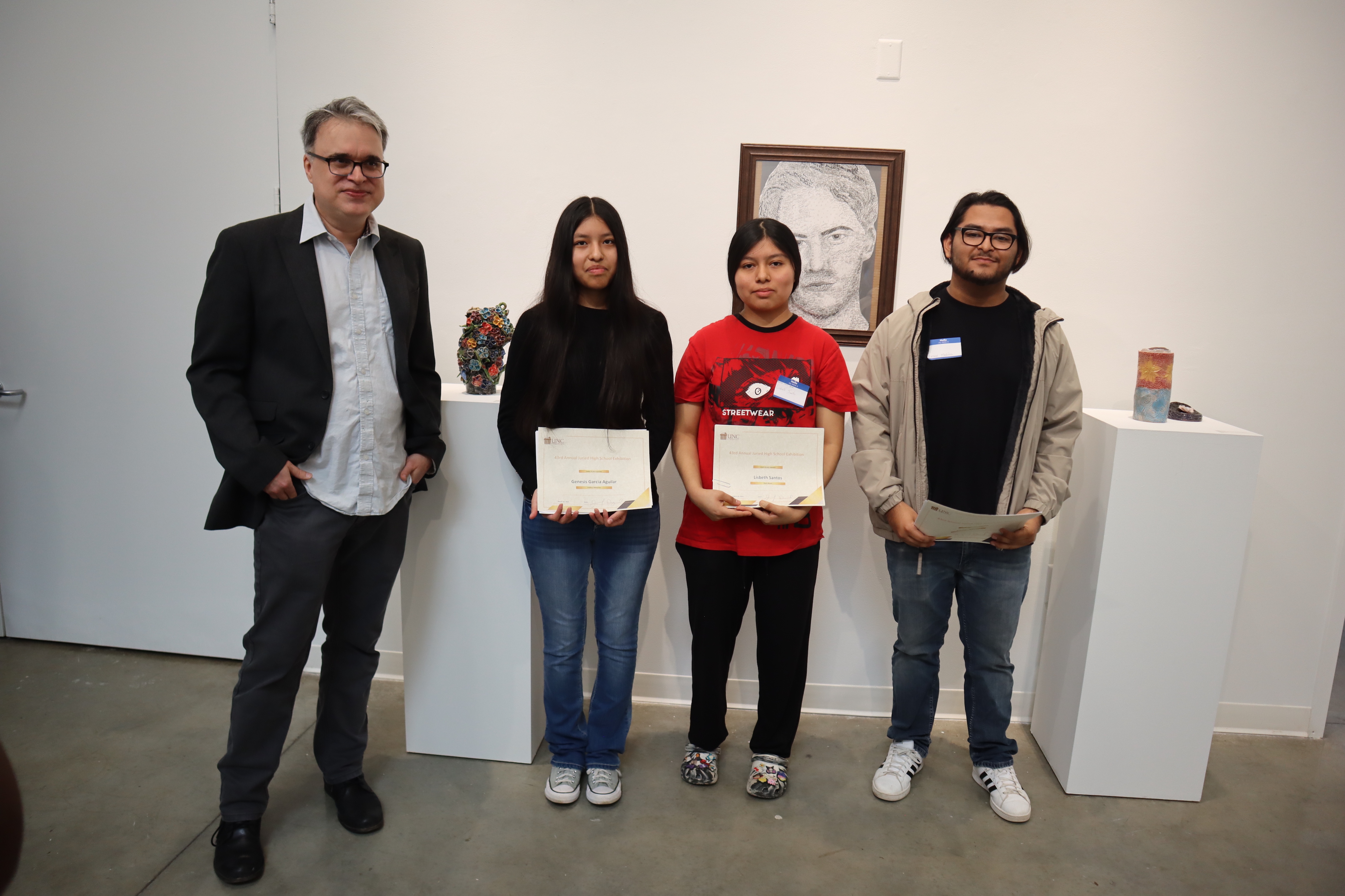 Joseph Begnaud (left) with winners, Genesis Garcia Aguilar, Lisbeth Santos and Cesar Medina