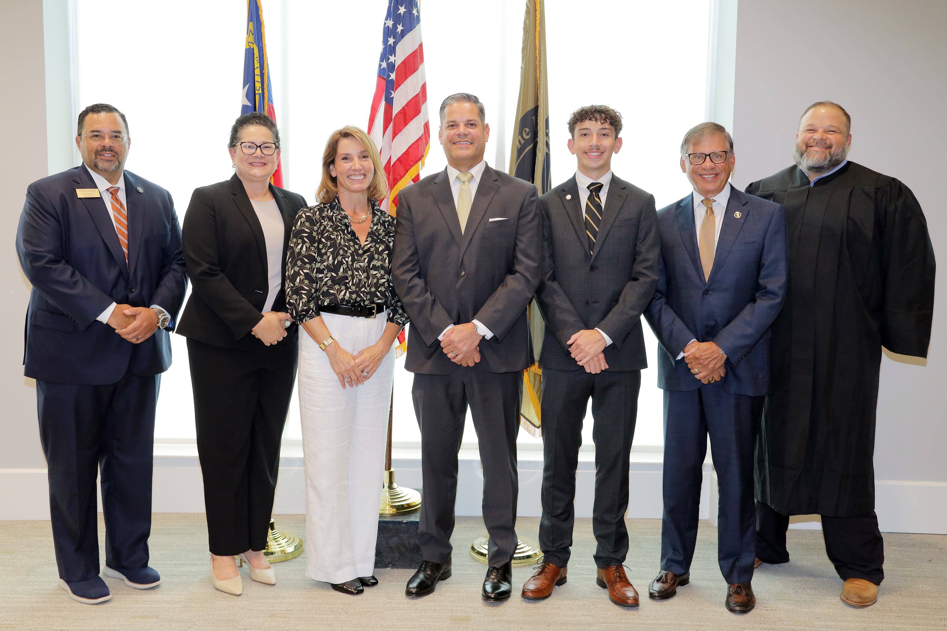 (L-R) Trustee Chairman Ed Brooks, Sheila Cummings, Dr. Anna Clark, Colonel (Ret.) Carlos E. Berdecia, John Squier, Chancellor Robin Gary Cummings and District Court Judge Daniel Locklear
