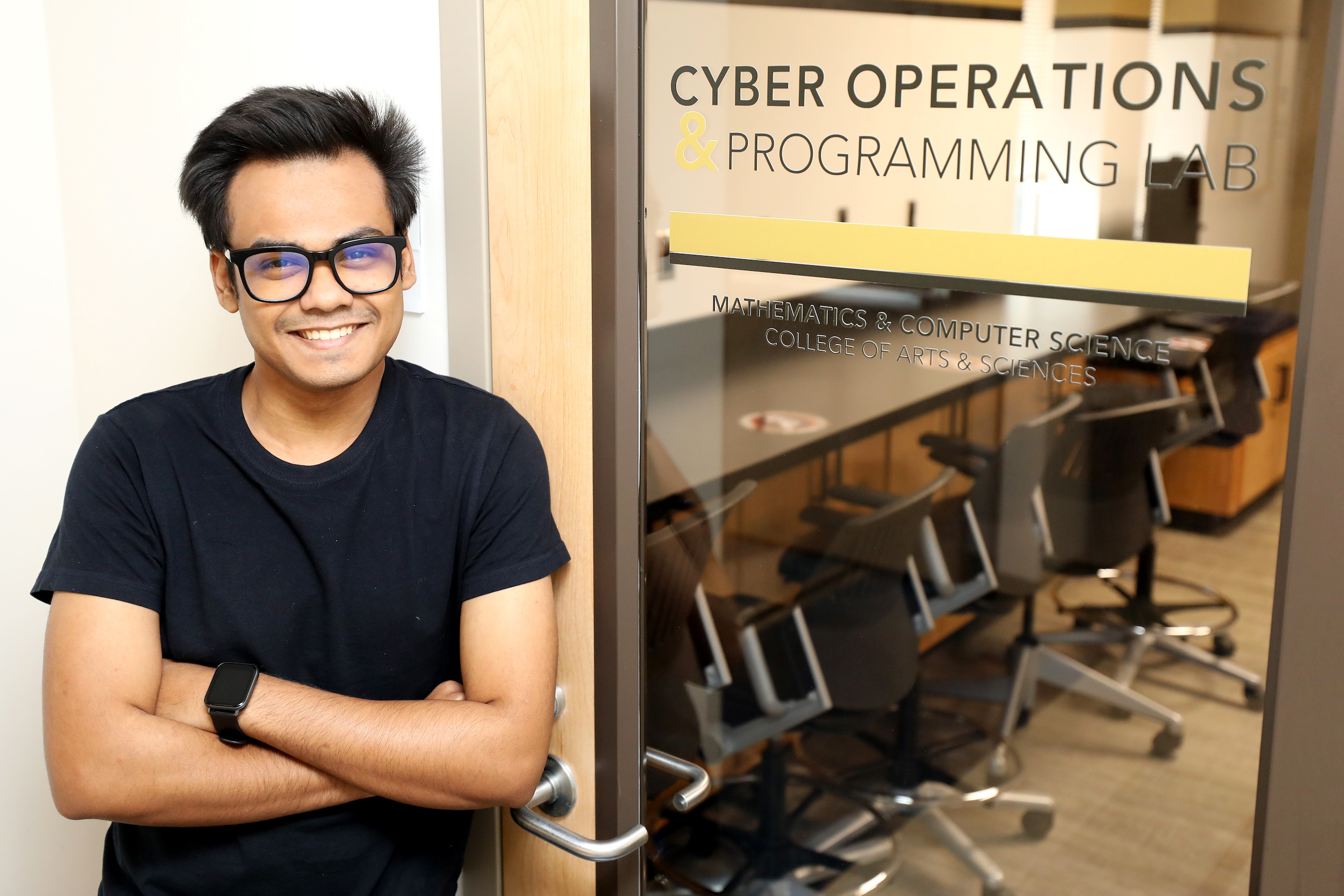 Shirsendu Mondal in front of the Cyber Operations Programming Lab