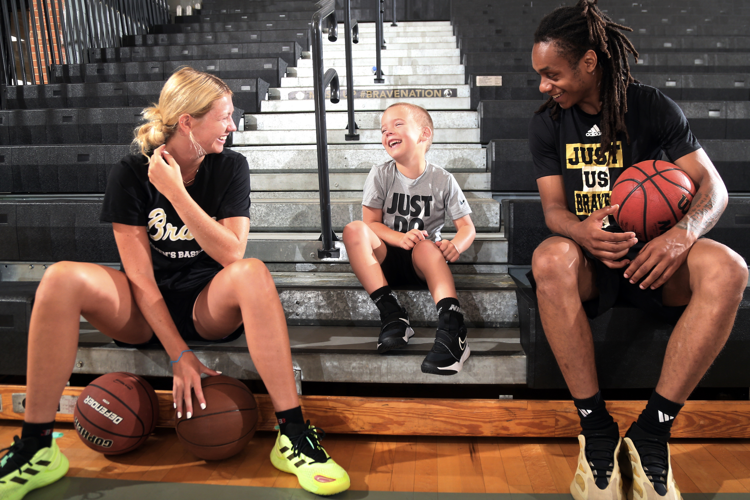 Kelci Adams (left) and Bradlee Haskell entertain a youth