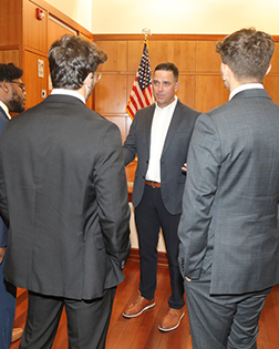 Col. Chad Mixon speaks to a group of students
