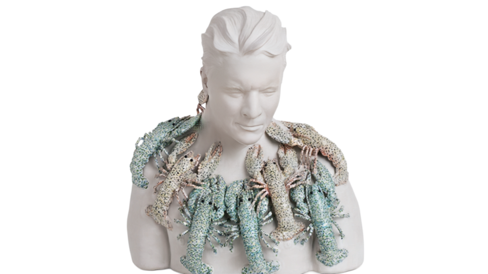 statue bust of a man with lobsters in a necklace around his neck