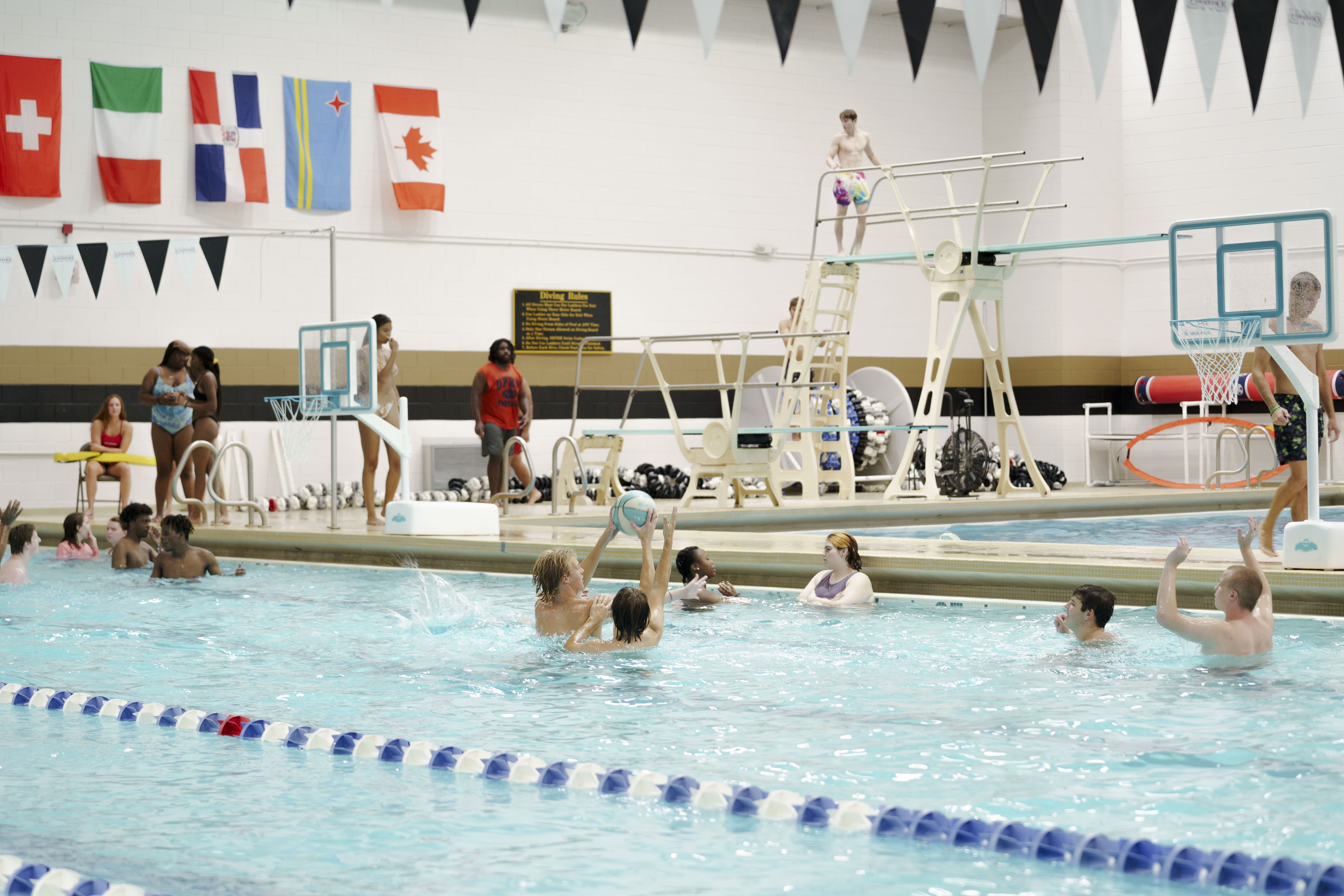 UNCP students playing basketball in the pool