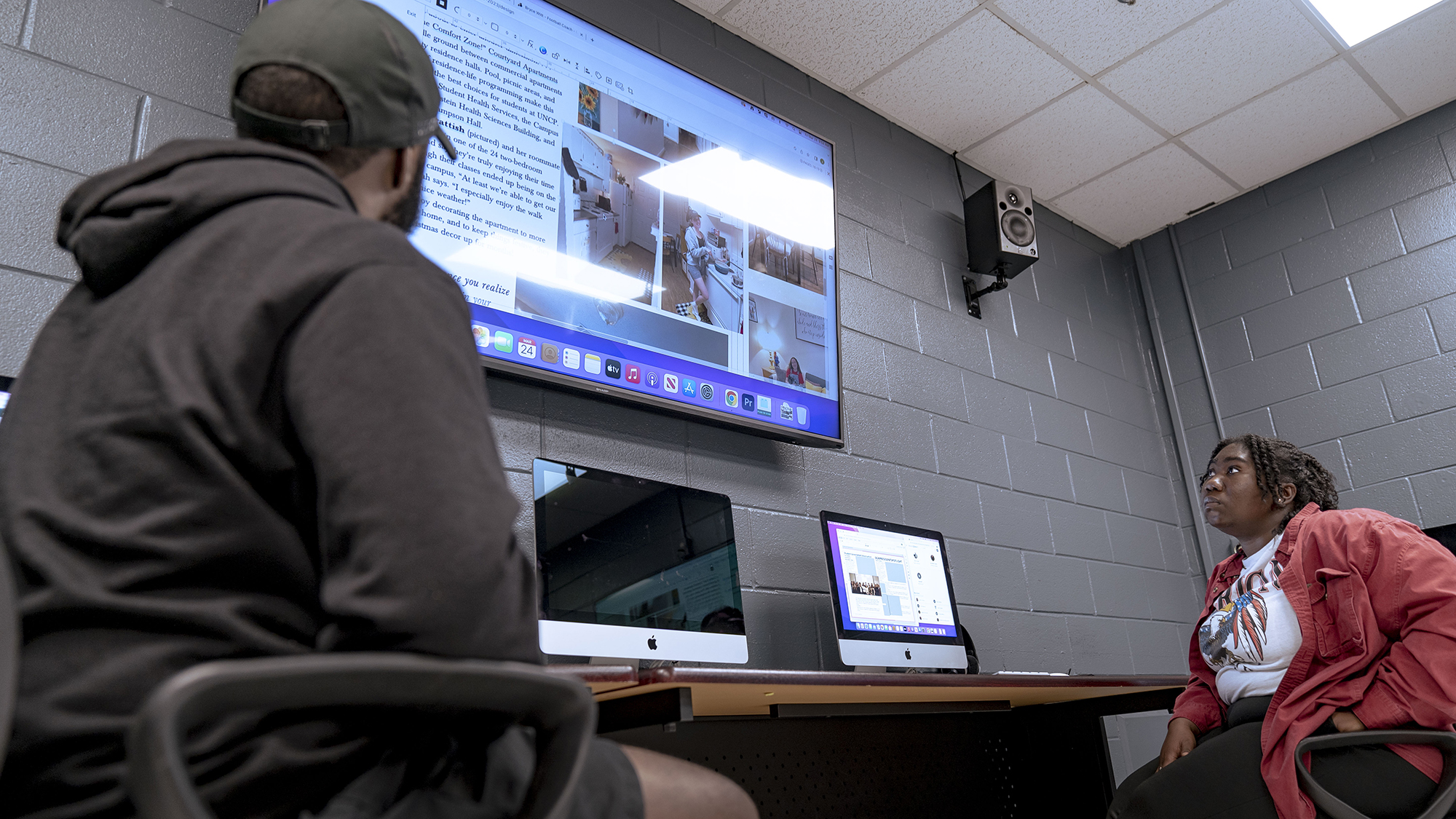 students looking at large screen in UNCP classroom