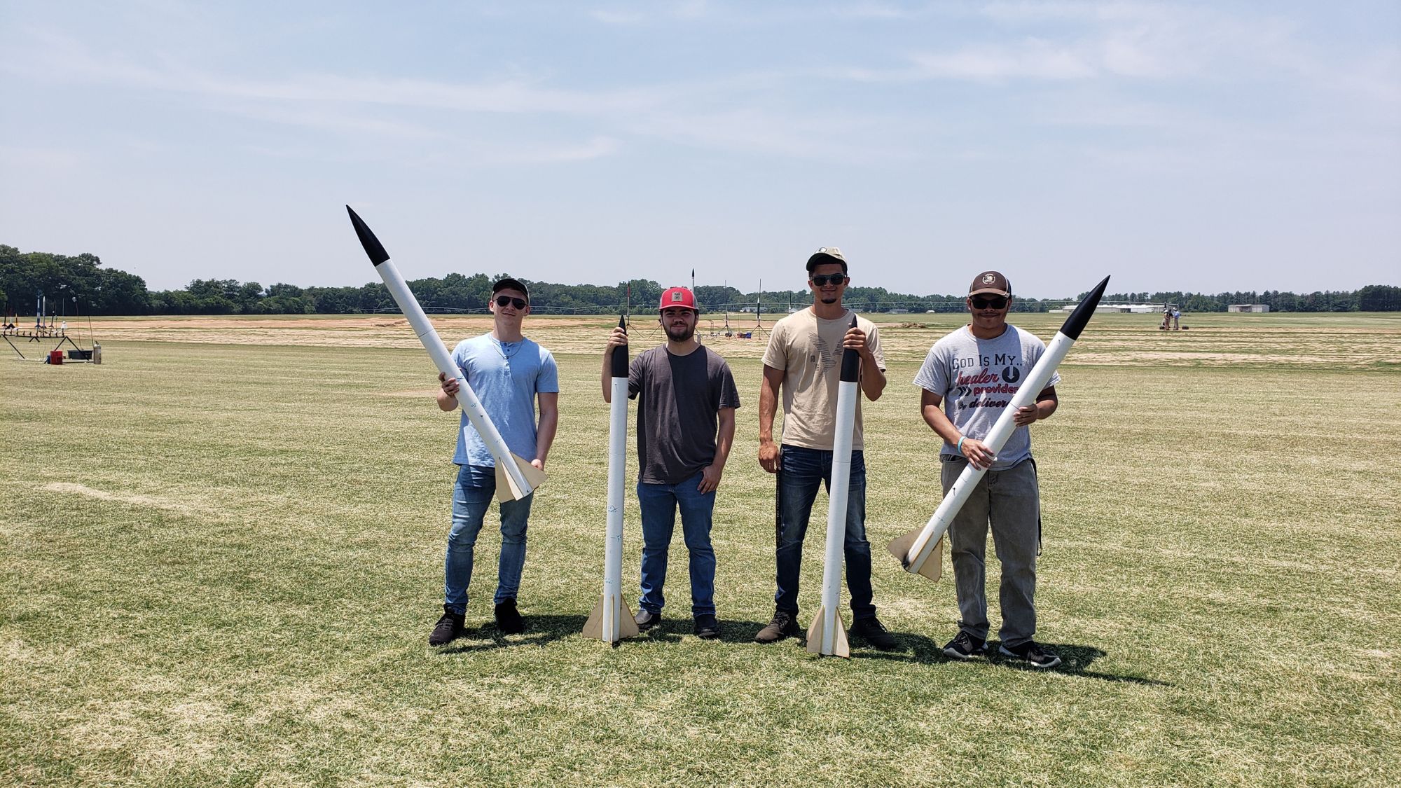 Members of the UNCP Rocket Team prepare their launch vehicle for competition testing.