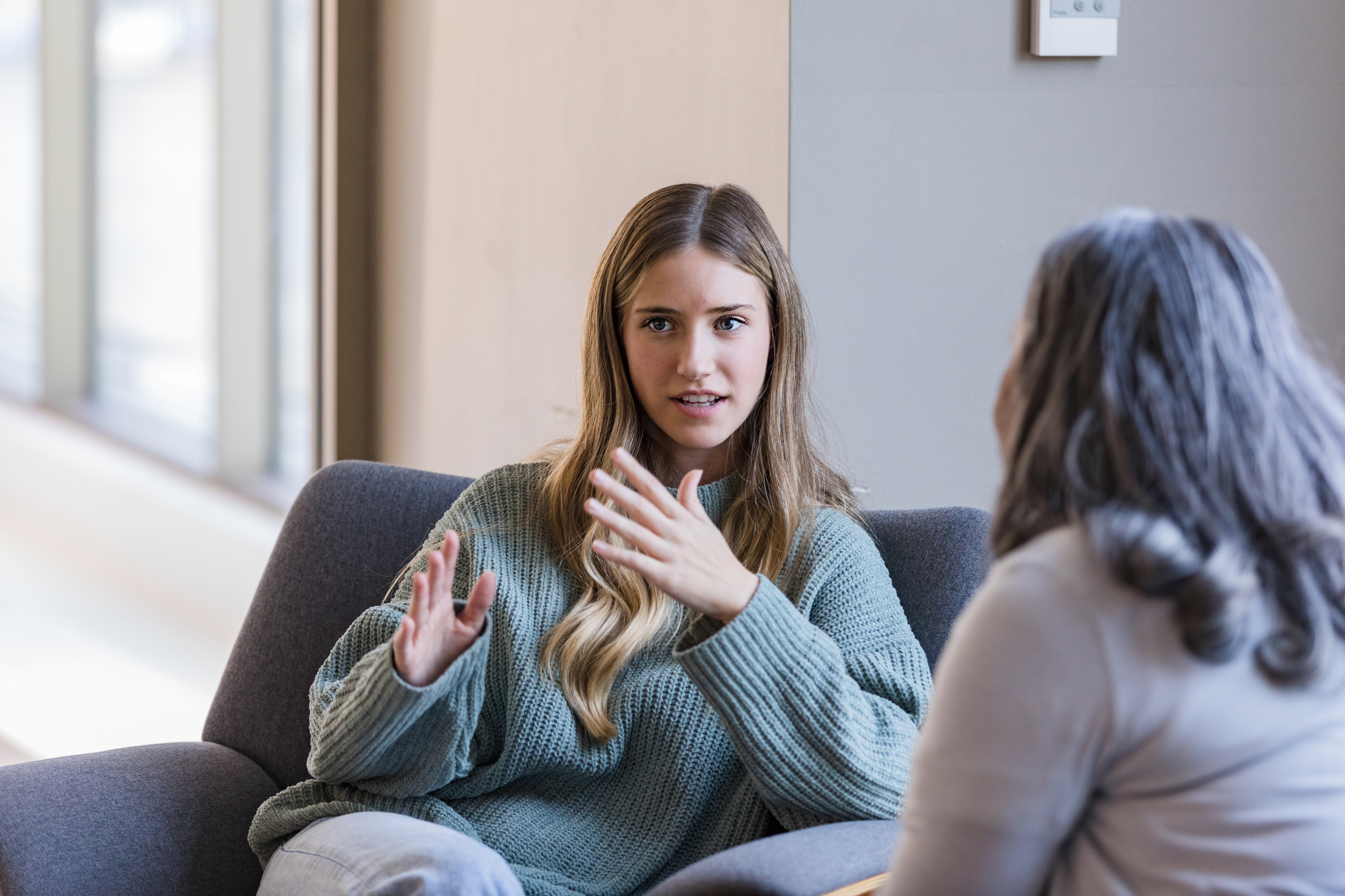Student talking to mental health counselor