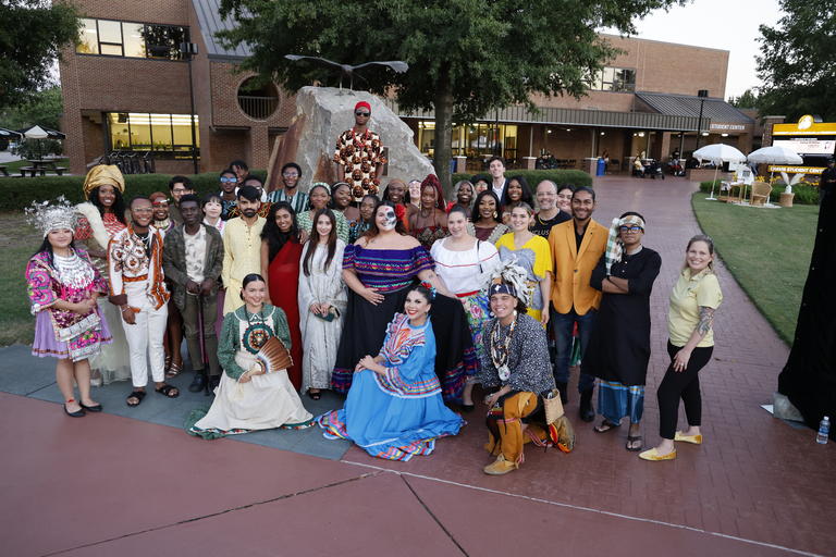 UNCP students particiapting in a cultural fashion show