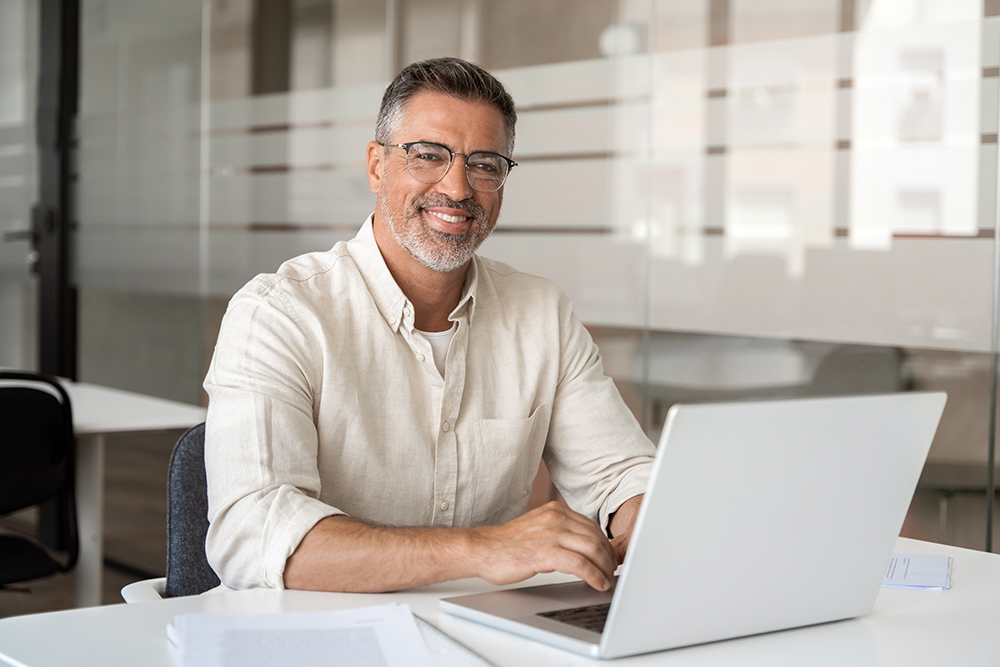 man sitting at a computer