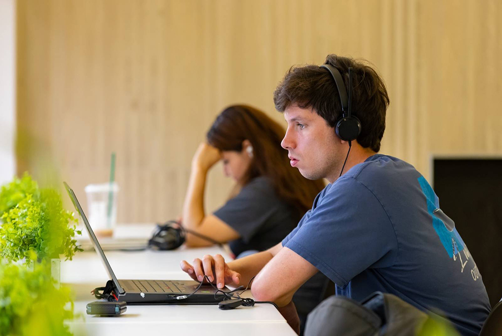 UNCP student looking at computer