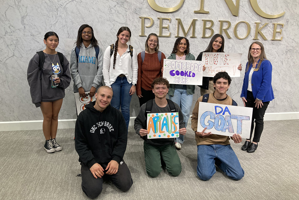 students in a group smiling UNCP