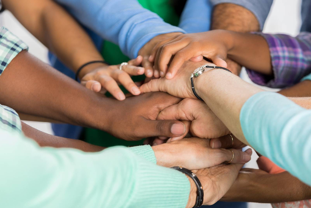 hands piled on top of each other