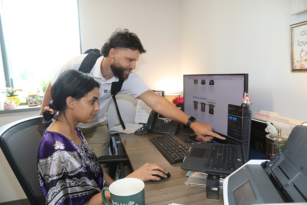 DoIt employee helping faculty UNCP