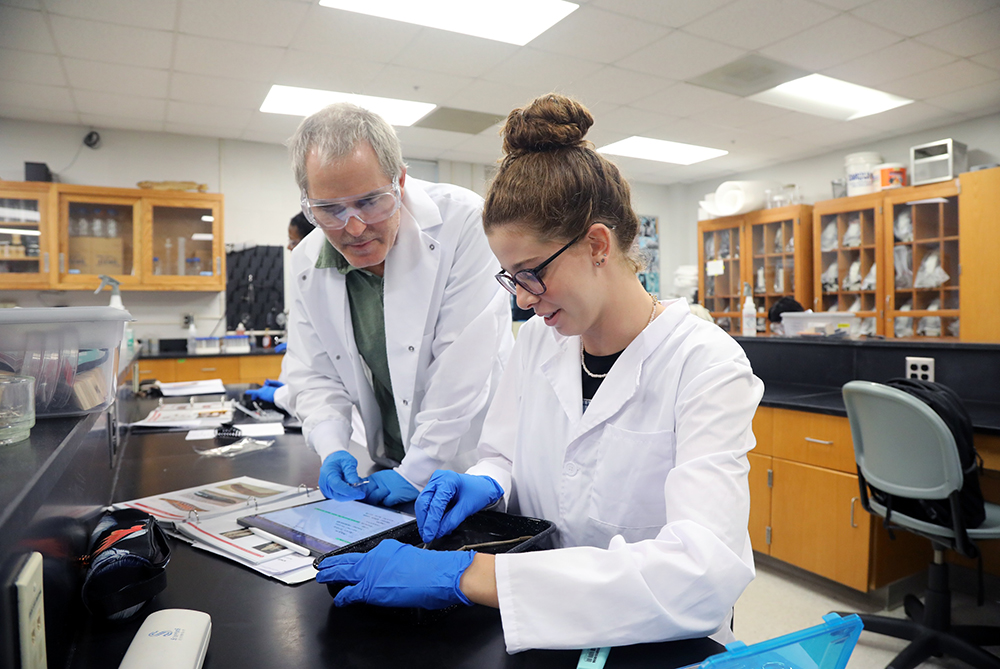 John Roe Zoology teacher with student UNC Pembroke
