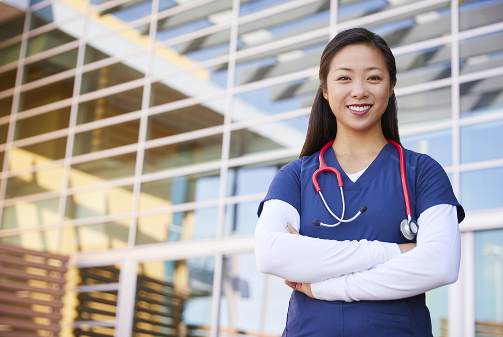 Nurse in front of hospital