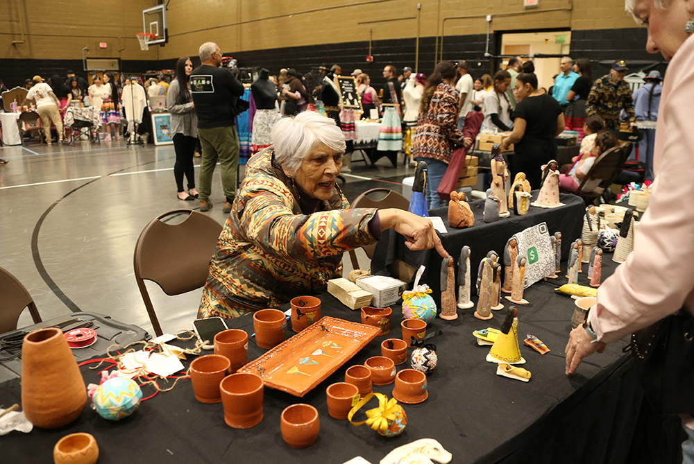 woman selling crafts at the event