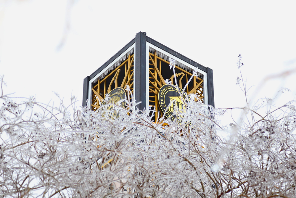 The Lowry Bell Tower on UNCP's campus covered in ice during inclement weather