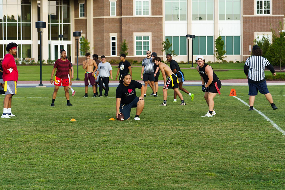 uncp students playing flag football