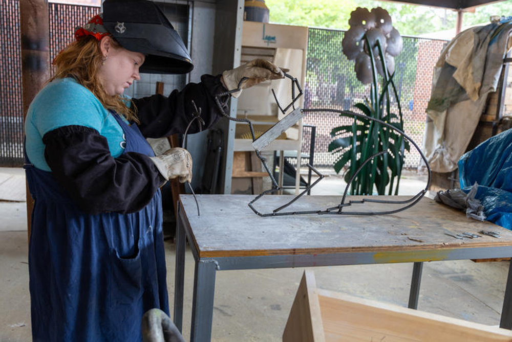 A student in UNCP's welding program