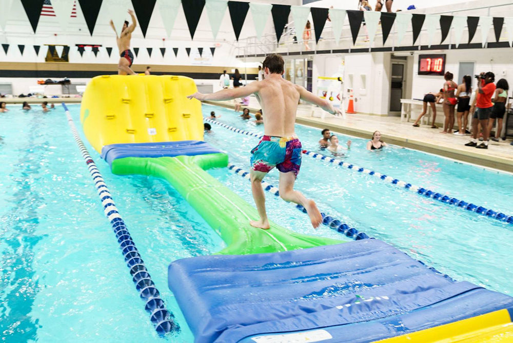 guy on pool obstacle in UNCP pool