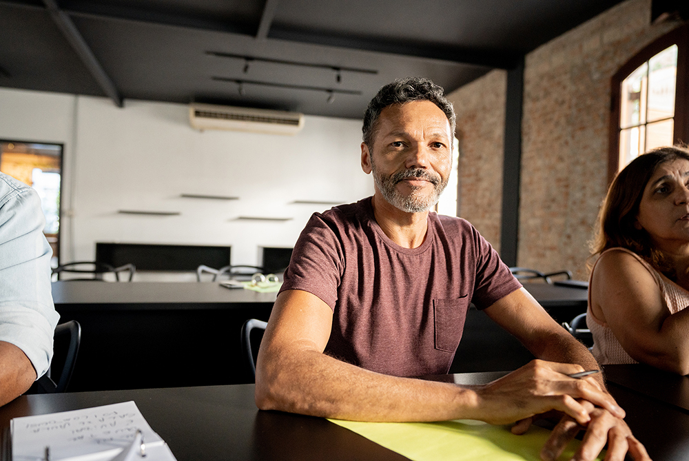 adult male sitting in a classroom