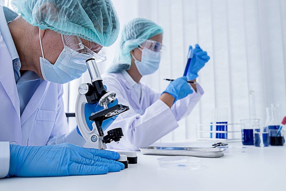 A modern depiction of biotechnology research with high-tech instrumentation and DNA imagery, reflecting UNCP’s cutting‐edge biotech initiatives.