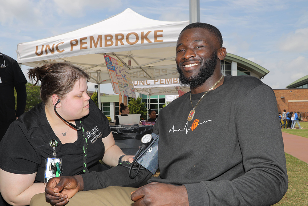 nursing student checking blood pressure