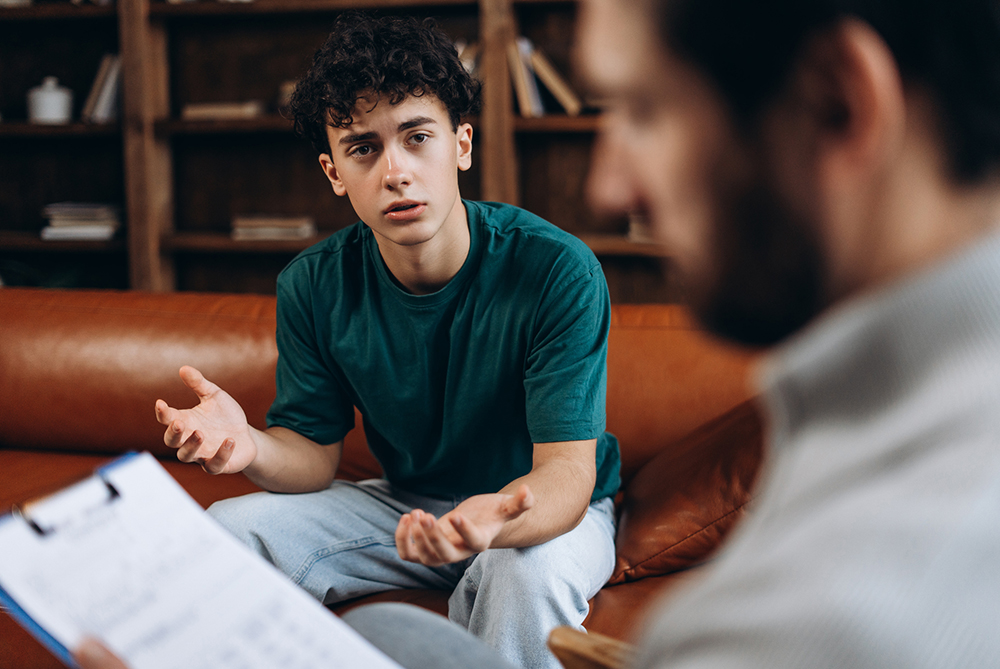 Male talking to counselor