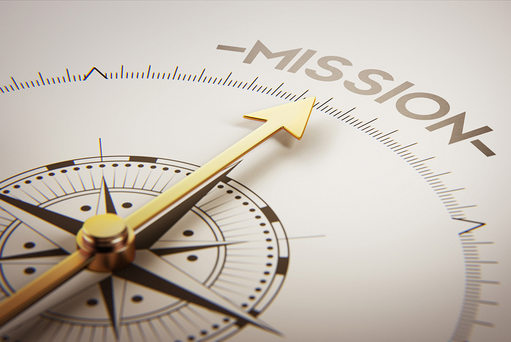 compass with arrow pointing to the word "mission"