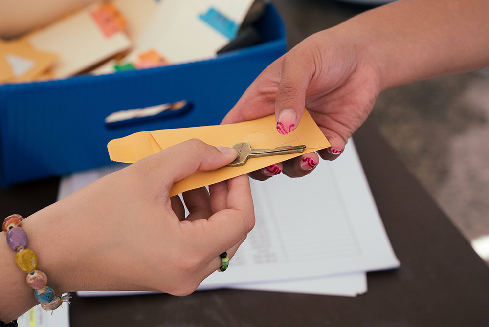 A key being handed to a resident