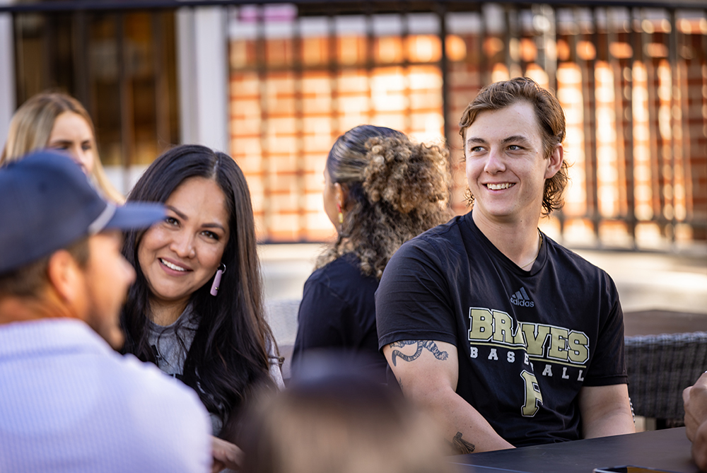 UNCP students sitting outside talking