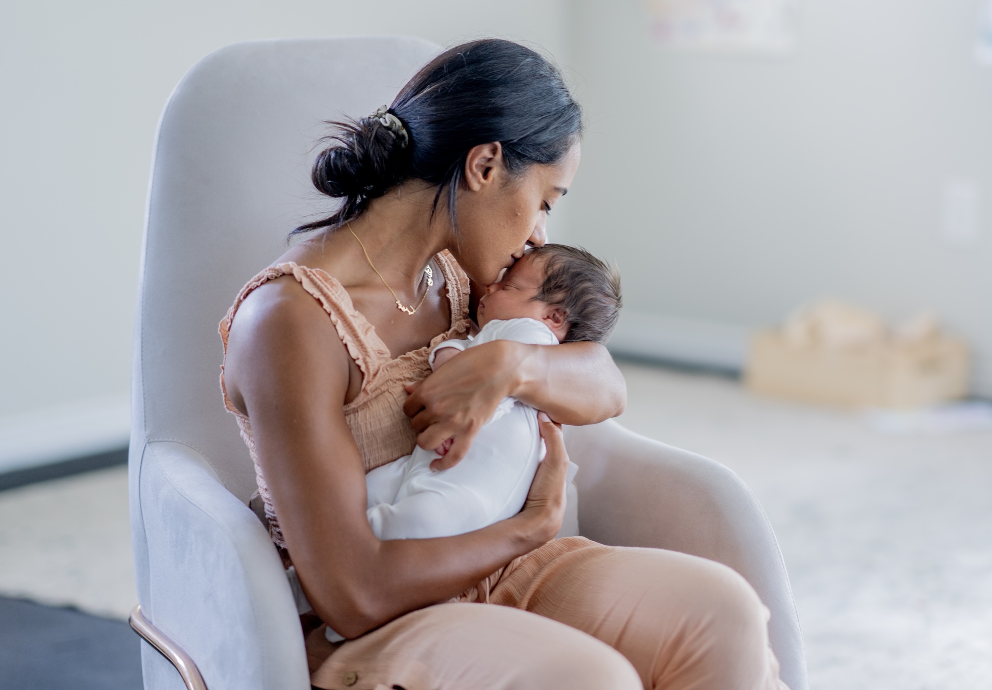 woman holding a baby hand