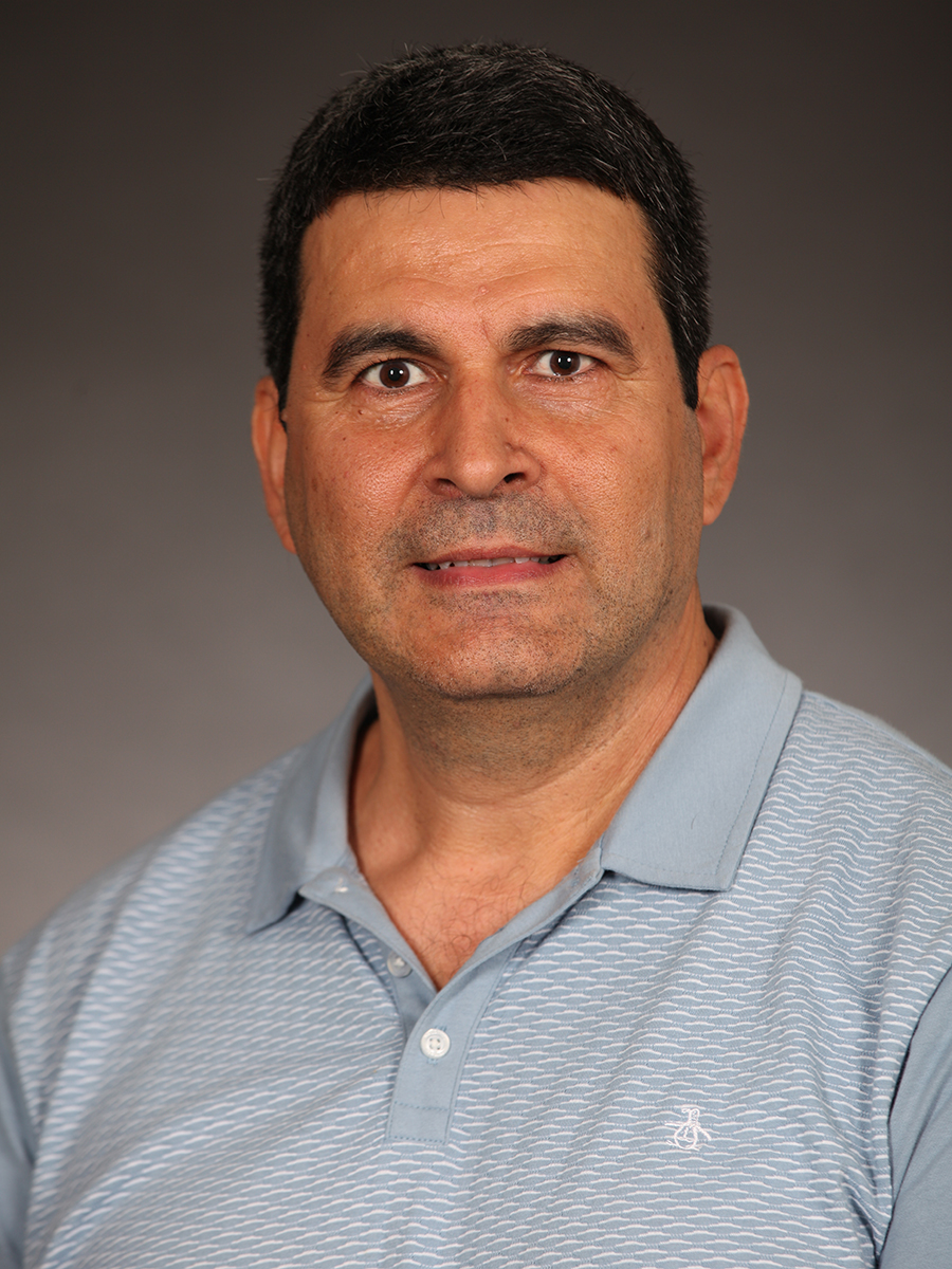 headshot of Ali Tosun