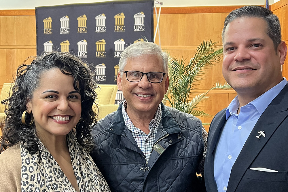 Retired Colonel Carlos E. Berdecia stands with UNC Pembroke Chancellor Robin G. Cummings