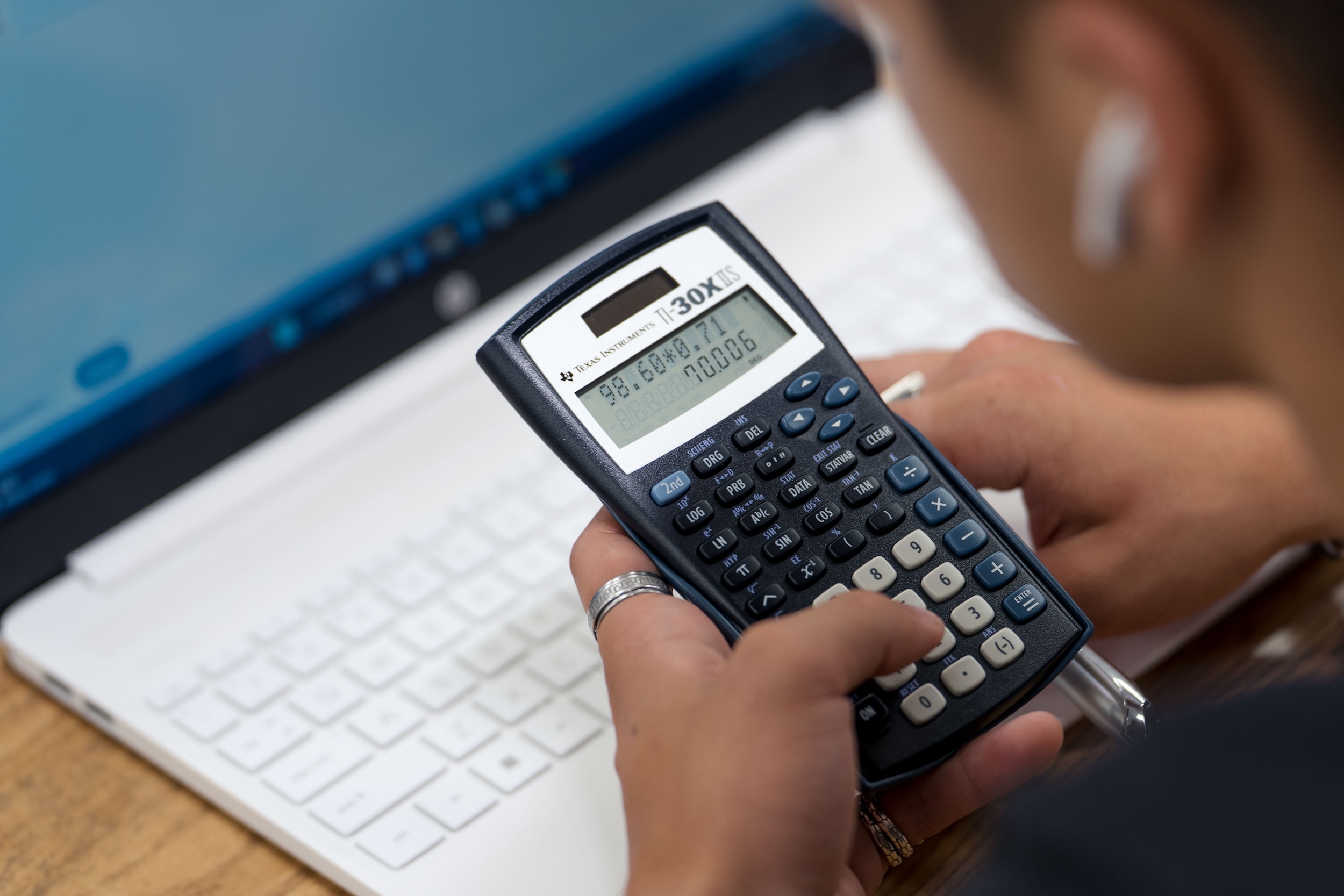 UNCP student in math class using calculator