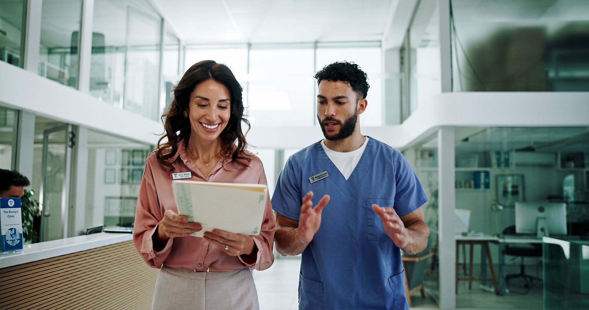hospital administrators walking in hallway and talking