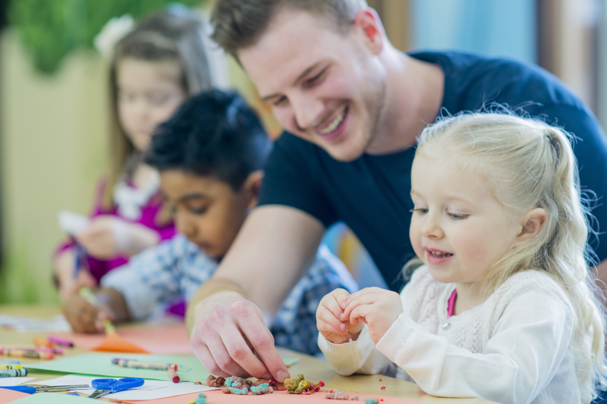 preschool teacher with a kid