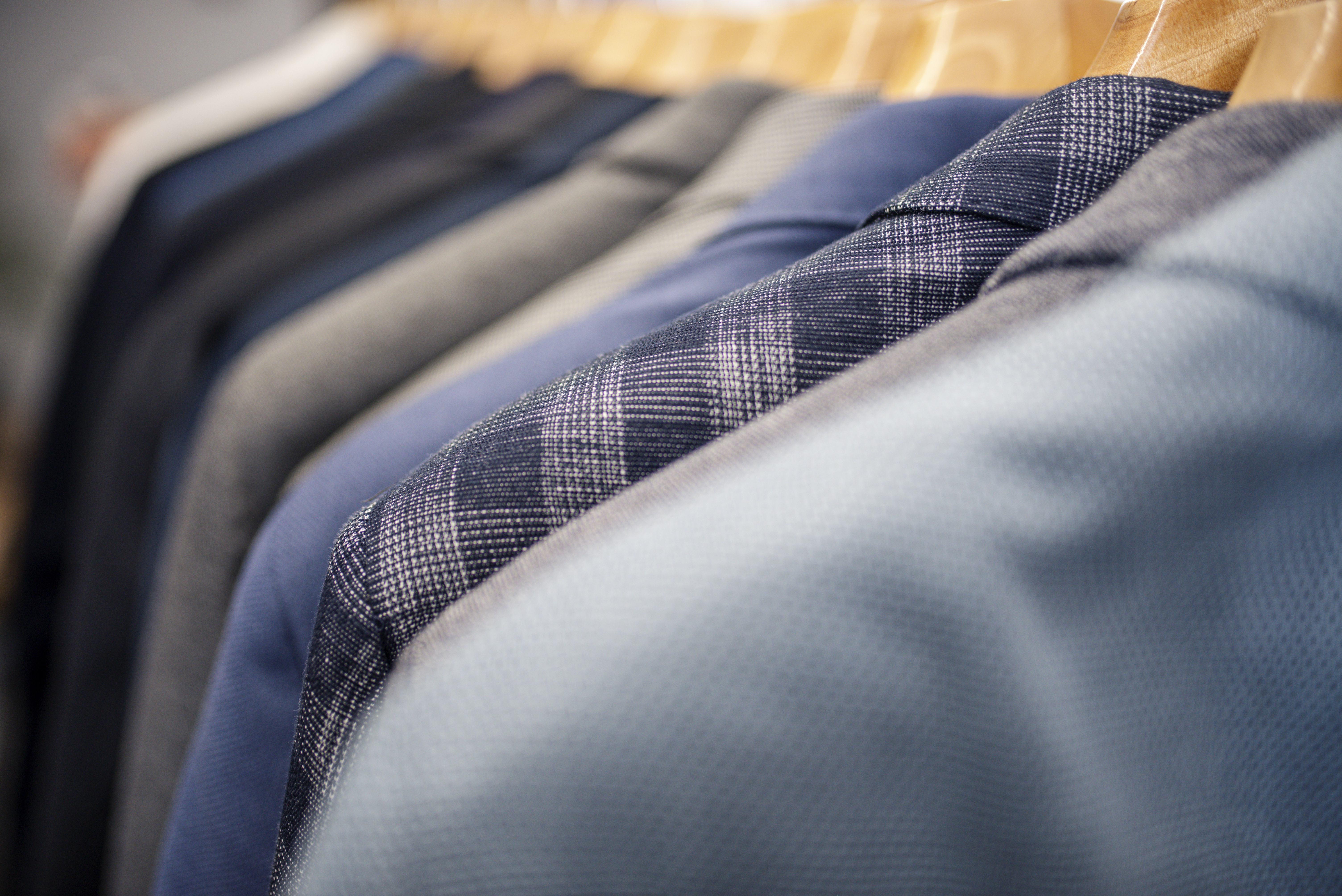 Suit jackets on a clothing rack