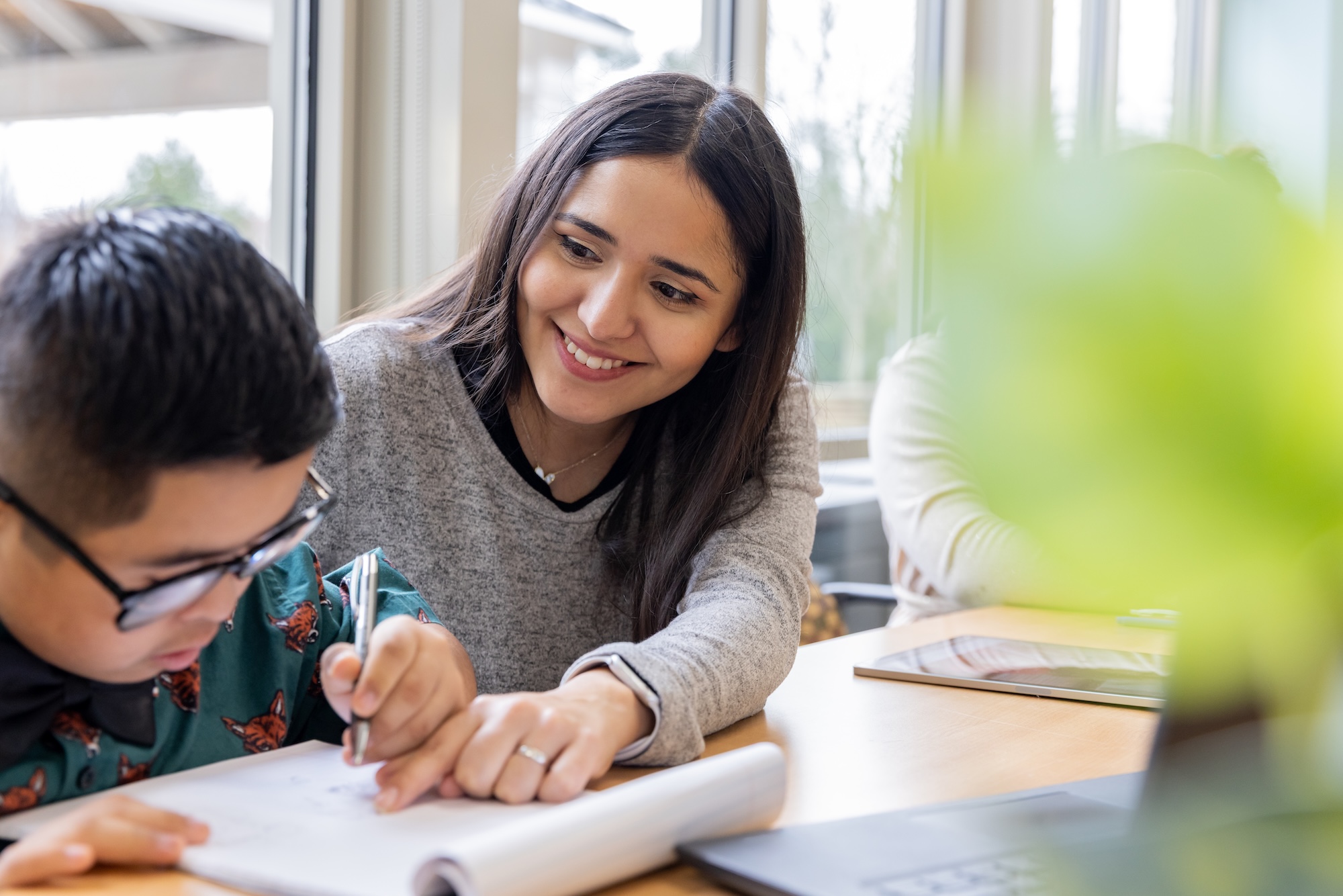 teacher helping student