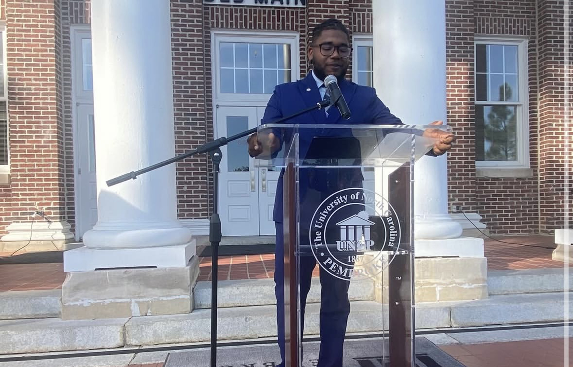 SGA President Speaking at Podium