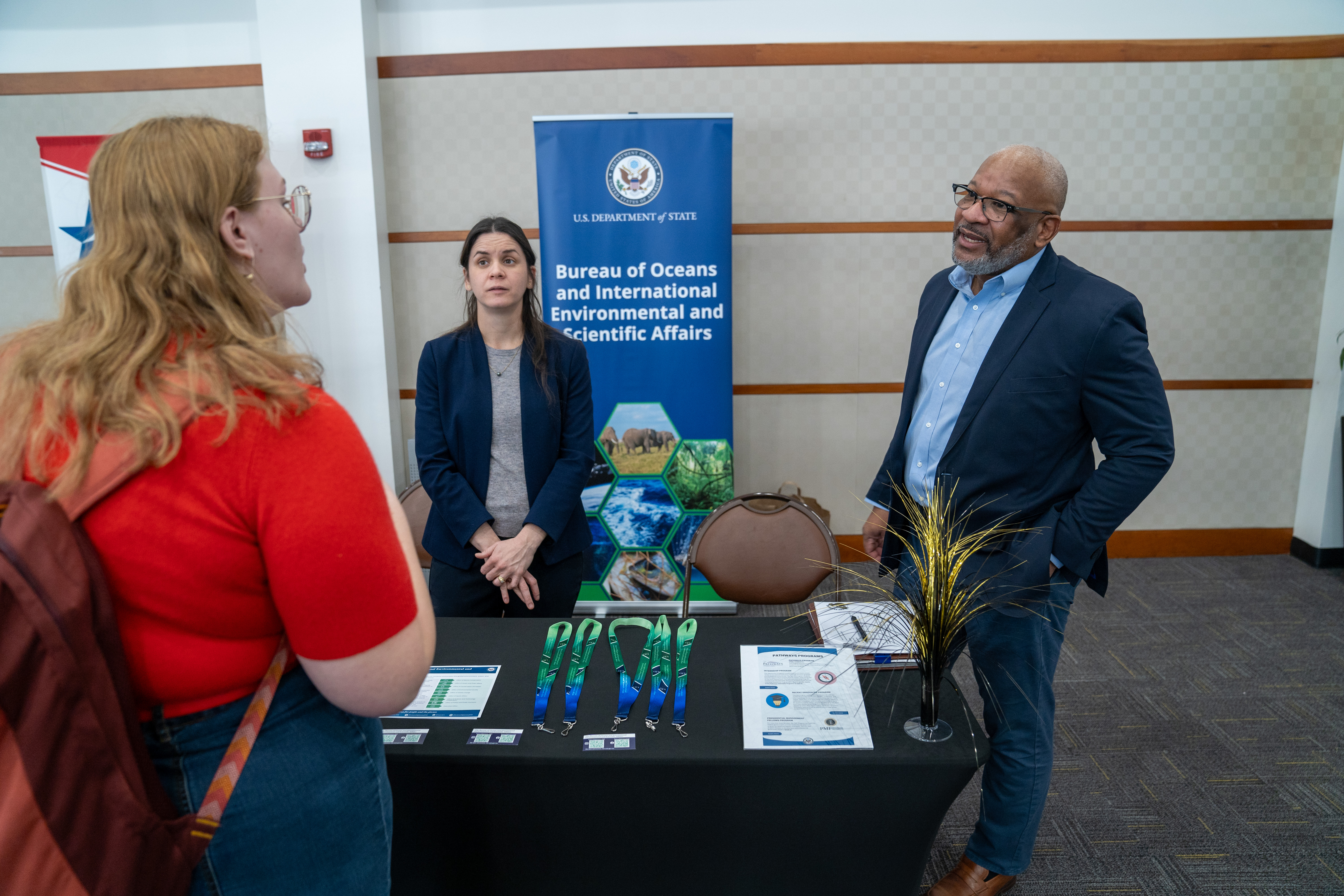 Student speaking with recruiters from U.S. Department of State