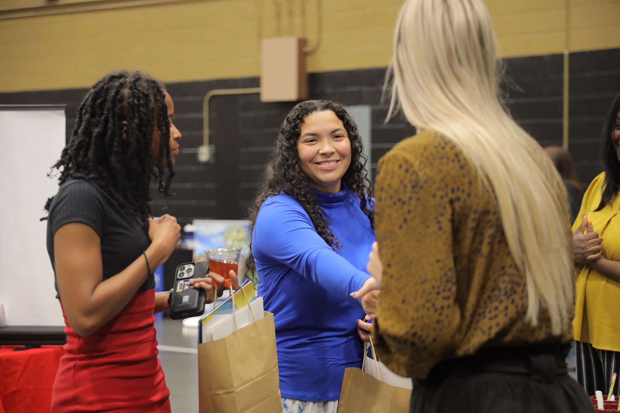 UNCP student shaking hands at a job fair