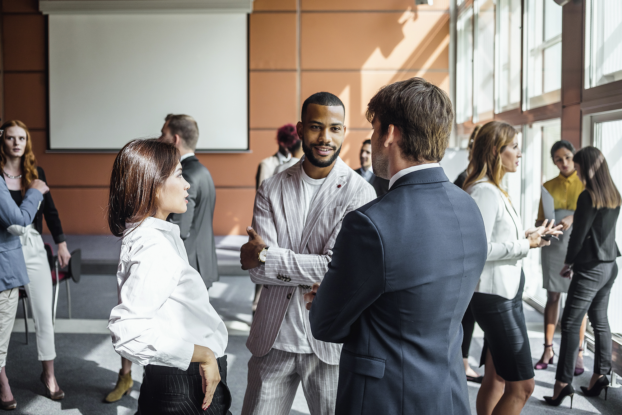 Students in business attire networking