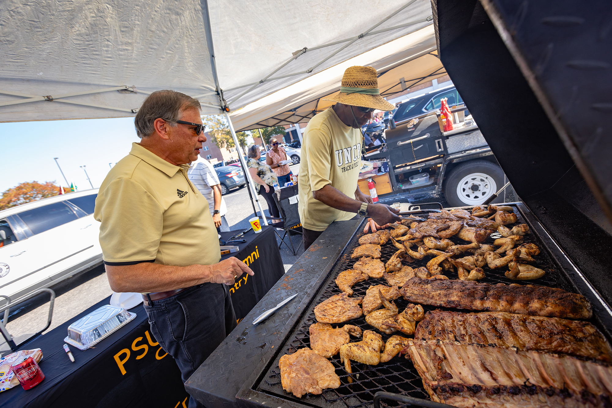 UNC Pembroke tailgating grills and alumni with the Chancellor
