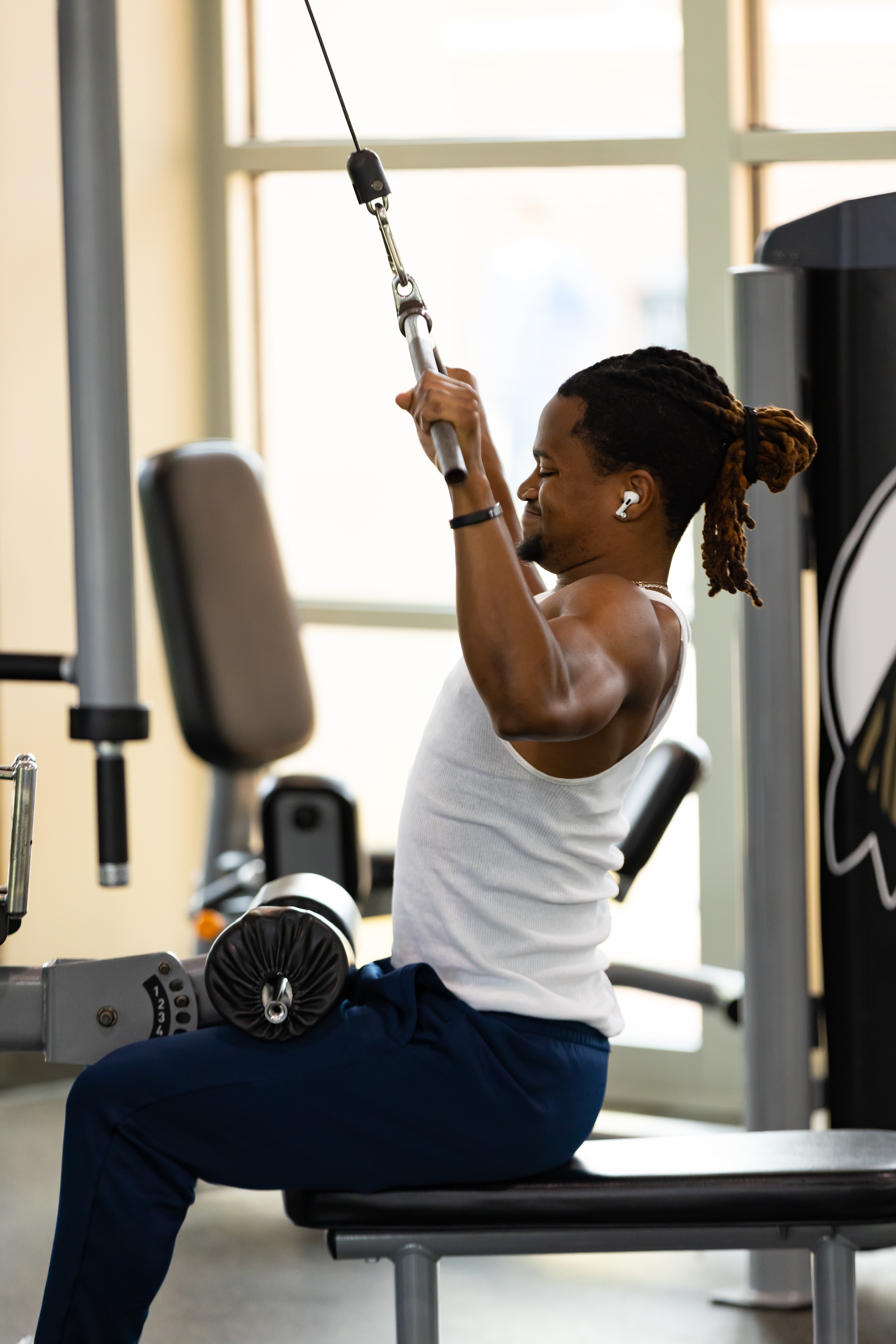 UNCP male student working out in wellness center