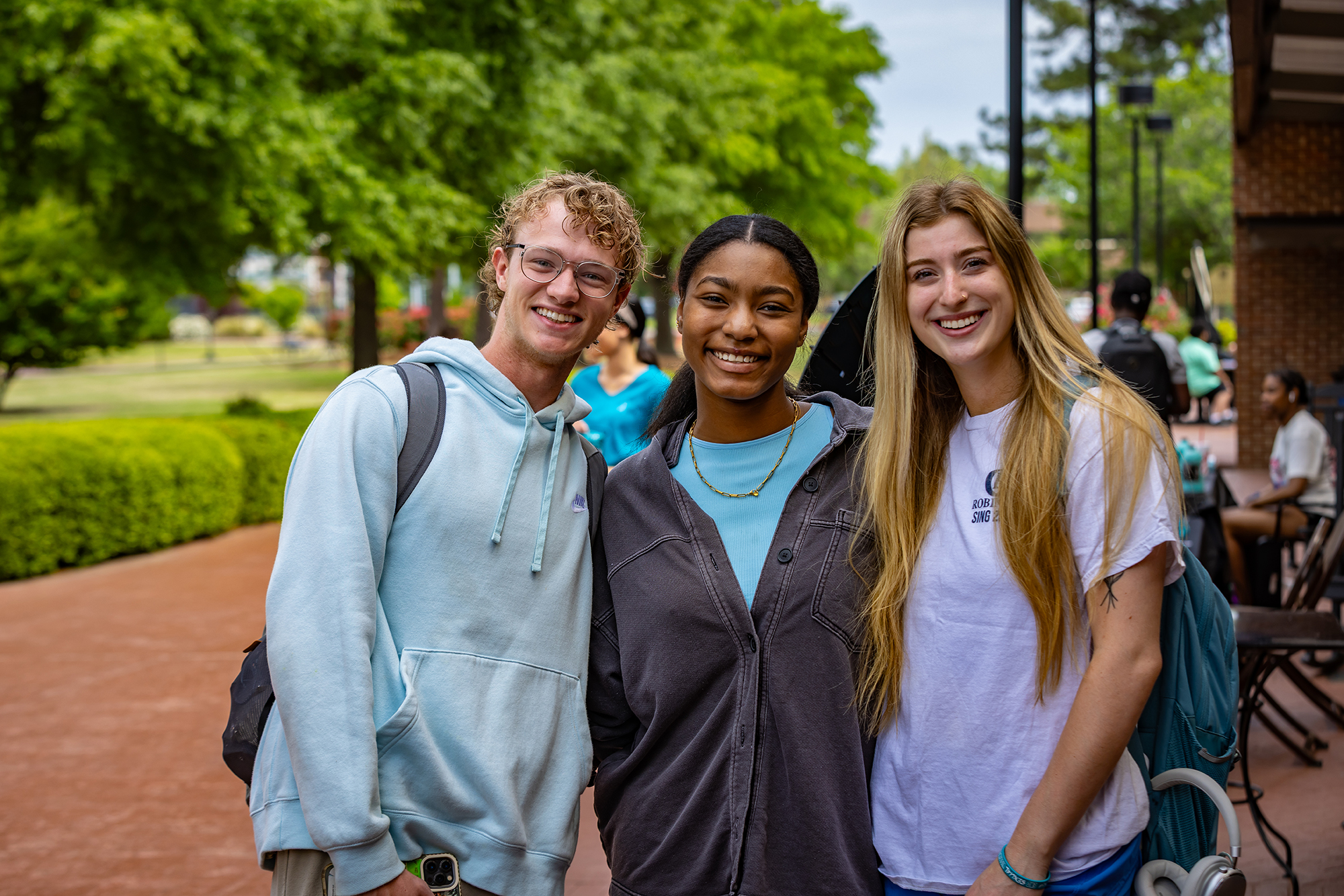 International students at UNCP standing in a group and smiling